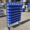 Shelf with blue containers - second-hand